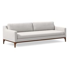 a white couch sitting on top of a wooden frame