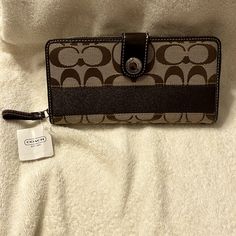 Beautiful Double Sided Wallet From Coach Khaki And Brown Colored With Silver Hardware Snap Closure On One Side With 12 Card Slots Wrap Around Zip Closure On Other Side 8” Length, 4” Height No Flaws Brand New With Tags Original Price Is $228 Coach Wallets With Snap Closure For Daily Use, Coach Brown Rectangular Wallet, Coach Rectangular Wallet With Snap Closure, Coach Wallet With Snap Closure For Everyday Use, Brown Clutch Wallet With Snap Closure, Brown Travel Wallet With Snap Closure, Plaid Purse, Pink Wristlet, Slim Leather Wallet