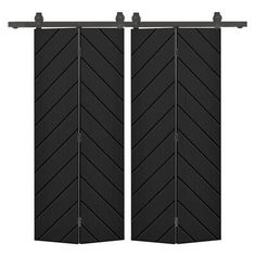 two black doors with an arrow pattern on them