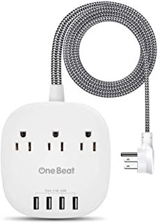 the one beat travel charger is plugged in to an outlet with three outlets