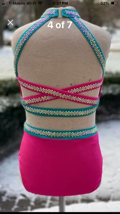 the back of a woman's swimsuit with beads on it