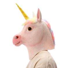 a man with a unicorn mask on his head