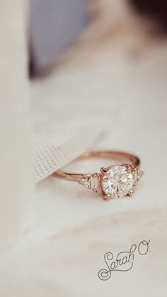 an engagement ring with three stones on it