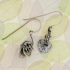 From Porans collection ----> Unique silver earrings with 5 hammered Hearts in different sizes, kinetic Jewelry, Perfect valentine's day gift Dimensions: Max Length: 33 mm\ 1.18 inches (from the top of the wire) Max Width: 12 mm\0.47 inches Matching ring: https://www.etsy.com/il-en/listing/466126360/unique-silver-charm-ring-for-her-modern?click_key=e912793142ae8fd71268330ed8627782e5363f40%3A466126360&click_sum=0db51e54&ref=shop_home_active_59&pro=1&frs=1&sts=1 Please let me know if you have any q Kinetic Jewelry, Charm Ring, Gift For Love, Matching Ring, Tiny Heart, Charm Rings, Matching Rings, Rings For Her, Earring Gifts