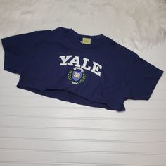 Yale University Shirt Women's Size Xl Crop Top Navy Blue Raw Edge New With Tags! Please Look At All Photos. Thanks! Flat Lay Measurements: Chest: 23.5" Length: 16" Blue Short Sleeve College Style Top, Blue Summer Shirt For College, Blue Cotton College Style Tops, Blue Cotton Tops For College, Blue Graphic Print Top, Blue Spring College Tops, Blue College Tops With School Spirit, Blue School Spirit Tops For College, Blue Spring Tops With School Spirit Style