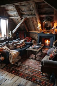 a living room filled with furniture and a fire place in the middle of an attic