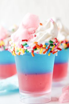 two cups filled with ice cream and sprinkles on top of each other