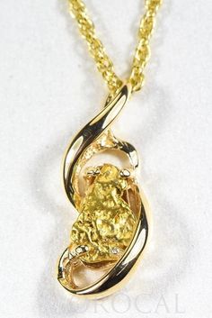 "Gold Nugget Pendant \"Orocal\" PN784NX Genuine Hand Crafted Jewelry - One of a Kind - 14k Casting-Approx. Total weight = 4.49G \" If this is not in Stock our Jeweler will make it in 4-6 weeks\" Specs and Dimensions: Length/Width Quartz Stone Size Bail Size - 6.25 x 1.25 mm With This Stunning Pendant you will receive a certificate of authenticity each of these Nuggets are placed in carefully by the Jeweler like a puzzle and it's very Labor intensive . Each Nugget is Natural and Found from the Mi Gold Nugget Jewelry, Natural Gold Nugget, Gold Nugget, Natural Gold, Gold Flakes, Pure Gold, Quartz Stone, Handcrafted Jewelry, Ring Designs