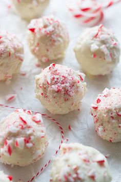 white chocolate and red sprinkles are on top of each other in the shape of balls