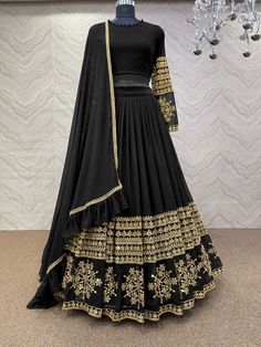 Bollywood Replica LehengaFaux georgette lehenga and choli with 5mm sequence embroidery work.Semi stitch lehenga and unstitch blouse material .Dupatta in faux georgette with ruffles work with four side lace border.Shipping time 5-7 daysBuy this Saree at Kollybollyethnics and make your occasion very special !!. With Express Free Shipping and Custom Stitching, Shop Bollywood Model Black georgette wedding lehenga at kollybollyethnics from India with free worldwide shipping. Luxury Party Wear Choli With Dabka Work, Luxury Black Lehenga With Dabka Work, Luxury Black Lehenga With Cutdana, Luxury Georgette Choli With Tiered Skirt, Luxury Black Lehenga For Navratri, Cheap Semi-stitched Bollywood Choli, Luxury Jamawar Floor-length Lehenga, Luxury Black Anarkali Blouse, Luxury Front Open Choli For Festive Occasions