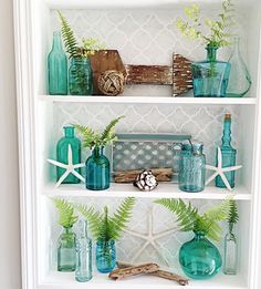 a shelf filled with vases and other items