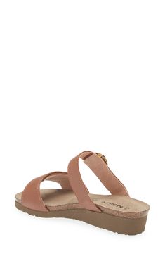 A rounded buckle stands out at the strap of a summery sandal set on a walkable wedge for everyday comfort and style. 1 1/4" heel (size 39) Adjustable hook-and-loop straps Cushioned footbed with arch support Leather upper and lining/synthetic sole Imported Brown Sandals For Everyday Spring Use, Brown Leather Footbed Sandals For Everyday, Everyday Brown Leather Footbed Sandals, Adjustable Slingback Sandals With Round Toe, Casual Wedge Sandals With Buckle And Single Toe Strap, Everyday Sandals With Buckle Closure And Round Toe, Casual Brown Footbed Sandals, Everyday Toe Loop Sandals For Spring, Leather Footbed Sandals For Everyday Summer Use