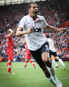 the soccer player is celebrating his goal in front of the crowd as he runs towards the camera