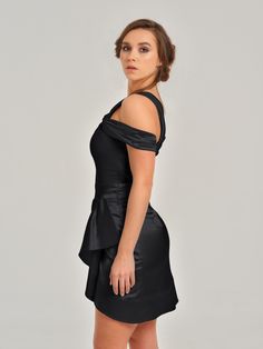 This feminine mini dress will make you feel irresistible with its gentle details. The intricate off-shoulder design features an asymmetric drape at the front, above-knee length and an invisible zip closure.  The dress is fully lined and its soft satin fabric will ensure you feel comfortable. It is fitted to the waist and shapes the body beautifully, bringing all eyes on you.  Choose this amazing look for your special occasion and enjoy every minute of wearing it! Hand wash only. Wash inside out Evening Off-shoulder Dress With Asymmetrical Neckline And Ruched Detail, Off-shoulder Mini Dress For Date Night, Off-shoulder Ruched Mini Dress For Formal Occasions, Off-shoulder Ruched Mini Dress For Evening, Ruched Off-shoulder Mini Dress For Evening, Ruched Off Shoulder Mini Dress For Evening, Evening Off Shoulder Ruched Mini Dress, Elegant Ruched Off-shoulder Mini Dress, Elegant Ruched Off Shoulder Mini Dress