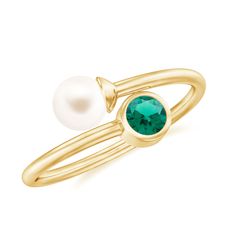 Product Details This Toi et Moi Ring is a perfect gift to show your love. The ring features two stunning gemstones, an emerald and a freshwater pearl. The toi et moi style is a beautiful representation of your relationship, making it a meaningful and cherished gift that your loved one will treasure for years to come. Whether as a gift for an anniversary, engagement, or just to show your love, this Emerald and Freshwater Pearl Ring is a perfect choice for a gift. Product Information SKU SHP-RINGS Emerald Ring Design, Two Stone Ring, Emerald Wedding Rings, Freshwater Pearl Ring, Emerald Wedding, Pearl Stone, Lab Created Emerald, Stone Wrapping, Wrap Ring