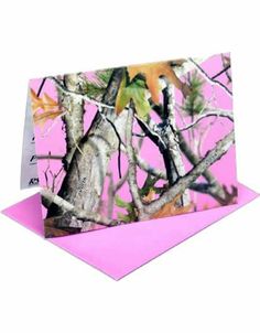 a pink card with camouflage trees on it