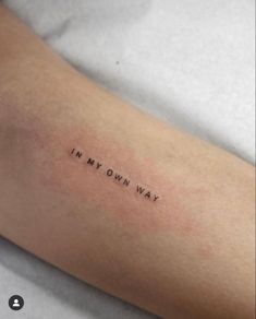 a woman's arm with the words in my own way tattooed on her left arm