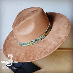 If you’re looking for the perfect accessory to complement your favorite boho style, look no further. The Boho-Style Western Felt Hat w/ Embossed Leather Hat Band by The Jewelry Junkie is absolutely everything that you need. Not only is it easy to incorporate into any and all outfits, but the genuine leather of the band immediately elevates whatever it is you’re wearing. Match your one-of-a-kind hat with any one of the matching accessories that we have for a completely gorgeous look. One Size Hat Brown Adjustable Hat For Festivals, Adjustable Brown Hat For Festivals, Adjustable Brown Hat For Festival, Adjustable Brown Bohemian Hat Bands, Handmade Turquoise Bohemian Hat Band, Southwestern Brown Hat Bands For Vacation, Southwestern Style Brown Hat Bands For Vacation, Southwestern Brown Hat For Vacation, Southwestern Style Brown Hat For Festival