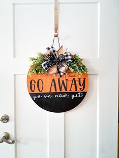 Hand painted Go Away Door hanger. There's no vinyl to peel in the heat, all hand painted! Greenery and bow may vary based on availability. Custom colors available upon request! Use code FREESHIP for pick up in Gilbert, AZ Colors may appear slightly different based on screen settings. To extend the life of your door hanger do not hang in direct sunlight, wind or rain. Halloween Door Signs, Painted Greenery, Pepper Tree, Front Porch Signs, Gilbert Az, Porch Sign, Halloween Door, Porch Signs, Door Sign