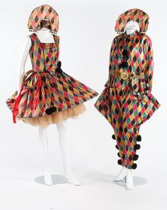 two mannequins dressed in colorful clothing on display