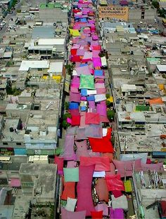 an aerial view of a city with lots of houses