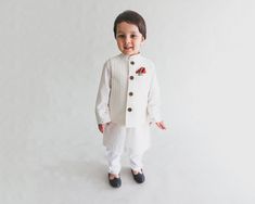 White embroidered  jacket on a fabulous white designer kurta with pajama  for your little boys.                                                                                                                                                                                                                                                                                                                                                    Cherishing the innocence of little kids, this snowy white ethnic Traditional White Fitted Pant Set, White Long Sleeve Sets For Diwali, White Long Sleeve Set For Diwali, Traditional Fitted White Pant Set, Off-white Sets With Dabka For Festivals, Off White Dabka Sets For Festivals, Traditional White Pant Set For Diwali, Traditional White Pant Set For Festive Occasion, Festive White Nehru Jacket With Dabka