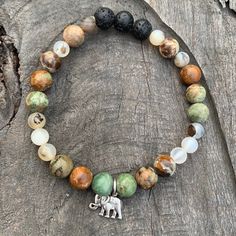 Stay Grounded While Abundance Flows To You! Brown For Grounding And Green For Abundance, Colors Of Earth And Nature. Moss Opal And Montana Agate. Elephant Charm Enhances Intention Representing Abundance...Luck. Lava Beads Act As Diffusers For Essential Oil Aromatherapy. Stretch Bracelets Approx 7.5”. Beading Bracelets, Clear Bracelet, Magnetic Beads, Aromatherapy Bracelet, White Pearl Bracelet, Sparkle Bracelet, Lucky Elephant, Elephant Bracelet, Stay Grounded