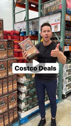 a man standing in front of shelves filled with beer bottles and other items that are labeled costcodeals