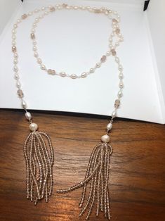 Gorgeous and delicate hand wrapped Freshwater Pearl necklace Huge pearls in tassel design All jewelry is shipped in a nice gift box. Check out our over a THOUSAND great reviews Elegant Pearl Long Necklace With Beads, Elegant Tassel Necklace For Party, Elegant Pearl Beaded Long Necklace, Elegant Dangle Tassel Necklace, Elegant White Tassel Necklace, Elegant Handmade Lariat Beaded Necklace, Elegant Beaded Pearl Lariat Necklace, Elegant Lariat Tassel Necklace For Party, Elegant Pearl Beaded Lariat Necklace