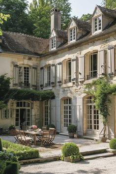 an old french country house with white shutters