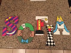 the letters are made out of paper and decorated with cartoon characters