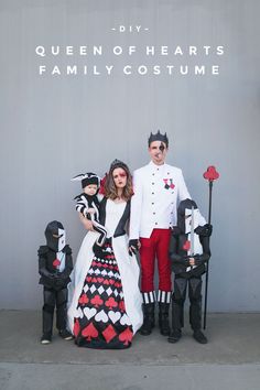 a man and woman dressed up in costumes standing next to each other with their children