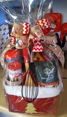 a basket filled with holiday food and baking utensils on top of a counter