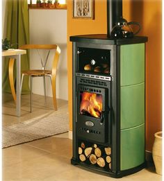 a wood burning stove in a living room with orange walls and flooring on the side