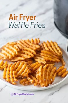 air fryer waffle fries on a plate with the words air fryer waffle fries