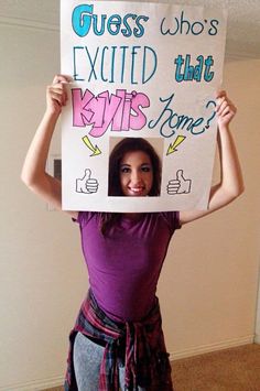 a woman holding up a sign that says guess who's excited that kytis bones?