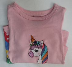 Pink Cotton T Shirts  Rainbow Embroidered Unicorn Long Sleves  Embroider Designs  Washing: gentle cycle and for drying use low heat You can iron but please cover the embroidery I love to use parchment paper  Any questions just ask me we are here to help! Pink Short Sleeve T-shirt With Machine Embroidery, Cute Pink T-shirt With Machine Embroidery, Cute Multicolor Embroidered Tops, Pink Cotton Top With Machine Embroidery, Pink Short Sleeve Top With Machine Embroidery, Pink Cotton Tops With Unicorn Print, Pink Cotton Unicorn Print Top, Pink Crew Neck T-shirt With Machine Embroidery, Pink Cotton Top With Unicorn Print