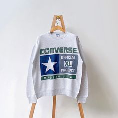 90s Converse all star made in USA crewneck sweatshirt/ L * PLEASE READ BEFORE PURCHASE * PLEASE consider the PHOTOS before making the decision * The images may DIFFER in appearance from the actual product because we took pictures under daylight.  * PLEASE send your PHONE NUMBER after your purchase for the shipping company to contact you X No returns X No refund Condition : 9/10 More details : look at the pictures  Brand : Converse Size on tag : L Pit to pit/ Chests : 24/48 inches  Length : 27.5 inches  Material : cotton polyester  Color : gray * ALL ITEMS are VINTAGE which may show some signs of wear and tear * Due to the different display and different light, the picture may not reflect the actual color of the item * Please, remember that our items are vintage so they may show some signs Throwback Crew Neck Sweatshirt For Streetwear, Oversized Throwback Crew Sweatshirt, Oversized Crew Neck Throwback Sweatshirt, Throwback Oversized Crew Sweatshirt, Throwback Crew Neck Sweatshirt With Logo Print, 90s Crew Sweatshirt With Logo Print, Retro Crew Sweatshirt For Streetwear, 90s Cotton Crew Neck Sweatshirt, 90s Style Cotton Crew Neck Sweatshirt