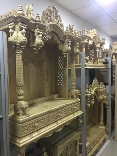 an elaborately carved wooden shrine in a shop