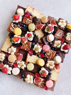 a square cake with many different types of desserts on it