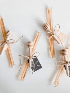 honey bee themed bridal shower favors tied up with twine and tag on white background