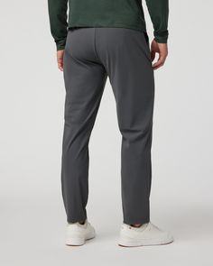 Office, golf, commute–the Fleet Pant is your new favorite overachiever. With a performance stretch knit that feels like a polished woven, you can take your last work call and make your tee time without the outfit change. Lightweight and highly breathable, these pants have a tapered leg, internal drawcord, and easy elastic waist complete with belt loops. | Vuori Fleet Chino Pants Athletic Slim 30" | Charcoal | 32 Vuori makes premium performance apparel inspired by the active Coastal California li Golf Bottoms With Go-dry 4-way Stretch, Athleisure Stretch Bottoms For Golf, Stretch Athleisure Bottoms For Golf, Stretch Moisture-wicking Golf Bottoms, Moisture-wicking Stretch Golf Bottoms, Moisture-wicking Athleisure Bottoms For Golf, 4-way Stretch Tapered Leg Golf Pants, Sporty 4-way Stretch Pants For Golf, 4-way Stretch Tapered Golf Pants