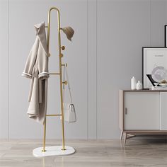 a coat rack with two coats hanging from it and a hat on the top shelf