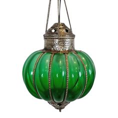 a green glass lantern hanging from a chain