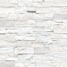 a white brick wall that is made out of stone