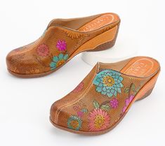 Step into a pair of these perforated leather clogs and let your personality bloom. The painted floral design adds a splash of color and artistry to every step. From L'Artiste by Spring Step. Multicolor Slip-on Clogs For Spring, Slip-on Clogs With Removable Insole For Spring, Spring Slip-on Clogs With Rubber Sole, Slip-on Clogs With Leather Sole For Spring, Multicolor Leather Clogs For Spring, Spring Slip-on Brown Clogs, Slip-on Brown Clogs For Spring, Spring Multicolor Leather Mules, Brown Slip-on Clogs For Spring