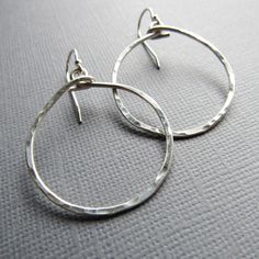 Modern Small Hoop Hammered Earrings, Modern Hammered Small Hoop Earrings, Everyday Small Hoop Hammered Earrings, Silver Hammered Open Circle Earrings, Hammered Circle Sterling Silver Earrings, Silver Hammered Hoop Jewelry, Silver Open Circle Hammered Jewelry, Hammered Sterling Silver Circle Jewelry, Sterling Silver Hammered Circle Jewelry