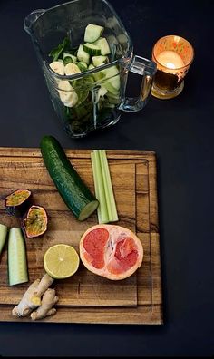 a cutting board topped with sliced up fruits and vegetables