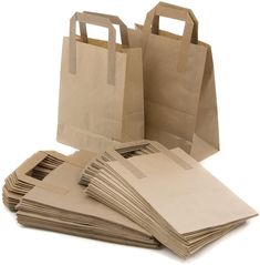 brown paper bags are stacked on top of each other