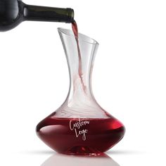 a red liquid being poured into a wine glass with the word california fog written on it